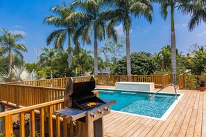 Relax, kick back, enjoy the barbecue by the pool.