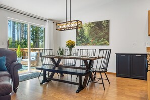Seating for six at the dining table with a view to the tranquil backyard.