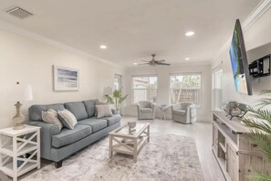 Cozy, large living room with 65-inch LG Smart TV.  Access to the lanai and yard.