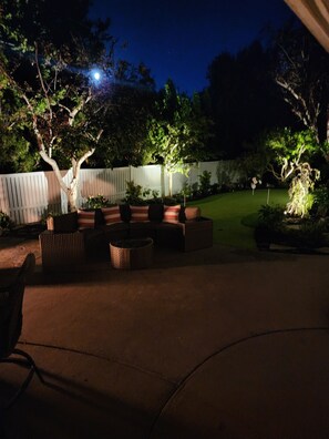 Lighted & beautifully landscaped for cozy evenings by the gas firepit