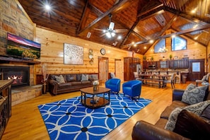 Our living room adorned with a calming blue rug, where comfort meets style for a truly inviting ambiance.