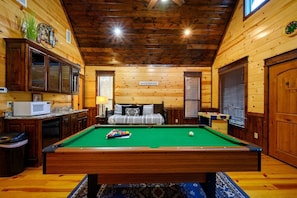 Enjoy a game of pool where friendly competition and laughter abound for an unforgettable evening of fun.