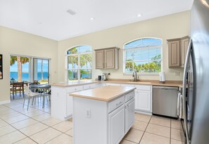 Large Open Windows in the Kitchen Close to the Dining Areas