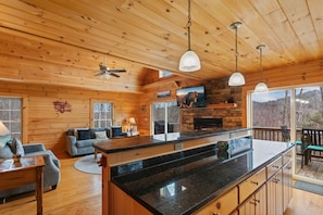 Open Floor Plan with Spacious Kitchen and Main Level Deck