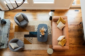 The view of the living area from the stairwell above. 