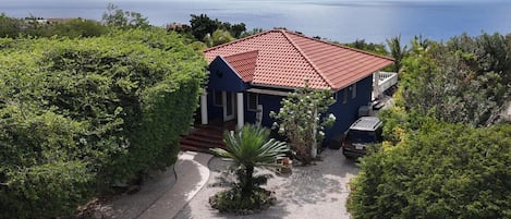 Entrance Dolphin house 621. Spacious garden with mature trees.