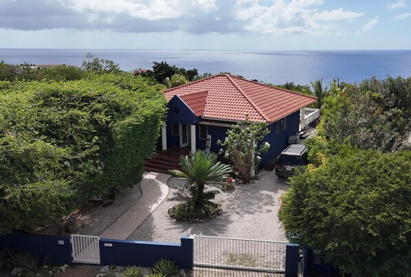 Entrance Dolphin house 621. Spacious garden with mature trees.