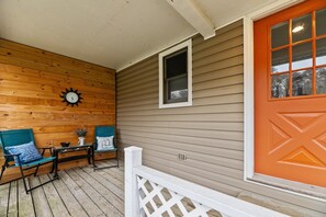 Serene retreat: Studio porch with free-roaming chickens.