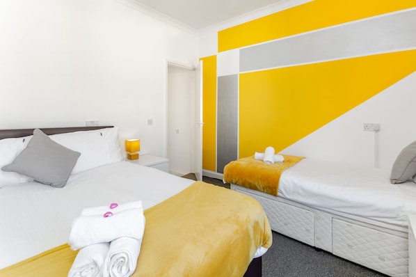 Bedroom 2 - one double and one single bed, luxury bedding provided