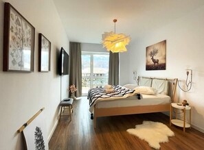 Large bedroom with queen sized bed, wide Smart TV, room darkening curtains, incredible Mountain View and fluffy towels and cotton linens