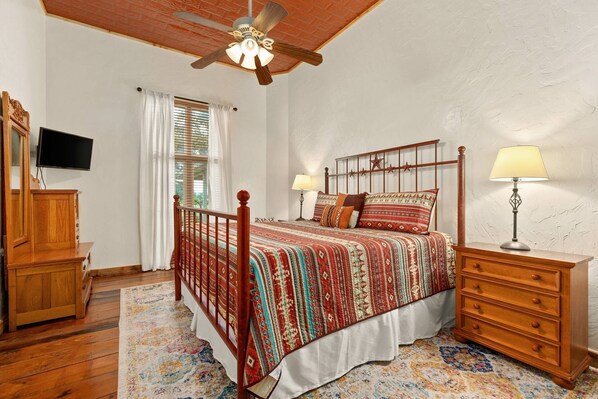 Retreat to the spacious private bedroom featuring a luxurious king bed, offering unparalleled comfort for a restful night's sleep.
