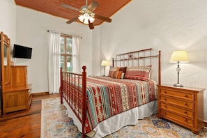 Retreat to the spacious private bedroom featuring a luxurious king bed, offering unparalleled comfort for a restful night's sleep.