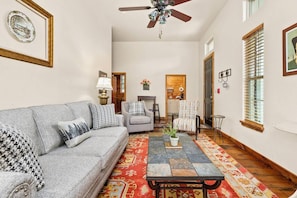 Unwind after a day of adventures in the expansive comfort of the living room, adorned with a plush couch and accent chairs.