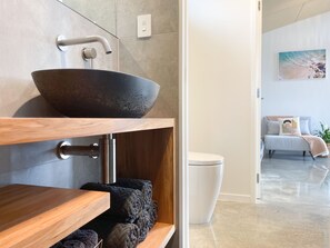 Guest Suite Bathroom with bespoke rimu vanity & concrete basin