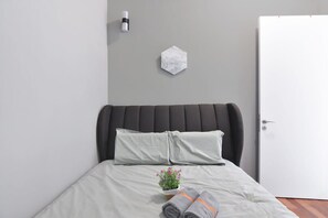 The second bedroom with a queen-sized bed.