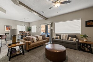 The living room can accommodate two additional guests on the sofa bed.