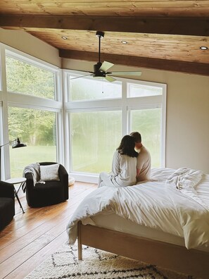 Enjoy the view from our panoramic floor-to-ceiling windows in our primary suite!