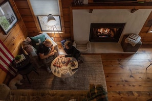 Romantic living room setting with a fireplace.