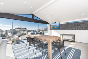 Our partially covered deck is perfect for any day of the year, offering a versatile space that combines the best of both worlds.
                