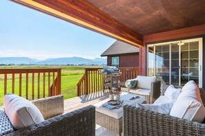 The covered patio offers Teton views and plenty of room to relax.