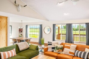 Our favorite details are the vibrant colors, mounted steer skull, and the painted white pine ceiling.