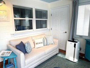 Cozy loveseat in the sunroom.