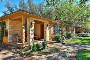 Inviting front porch welcomes you to your historic stay on Sayles!