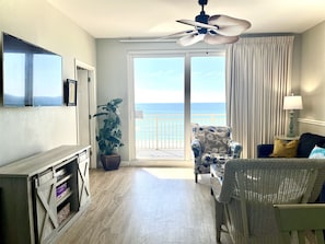 Living area with 65" TV, ocean view