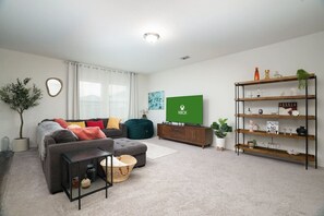 Spacious vacation home with large TV and cozy living room