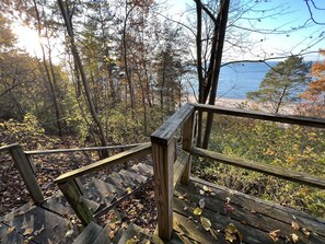 View of Lake Michigan and beach from backyard, top of bluff. 