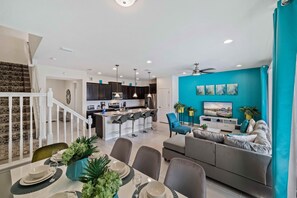 This open living space beckons with its expansive layout, creating a haven of relaxation and togetherness.