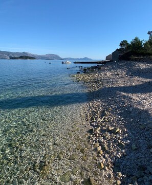 Pebble beach and clear beautiful sea