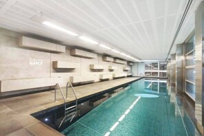 Dive into relaxation in the building's shared indoor pool, a tranquil space perfect for enjoying a refreshing swim.