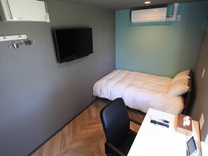 ・[Semi-double room] The room has a calm atmosphere with a mint green and gray color scheme.