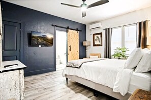 Enjoy the peace of a room designed for tranquility, with soft lighting and luxurious bedding