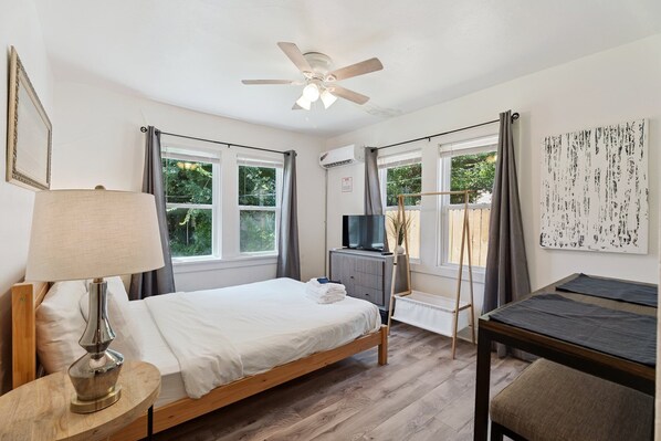 Plush bedding, soft lighting, and charming decor make this a restful retreat.