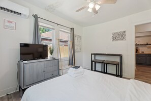 Relax after a day out with TV and comfy seating, surrounded by views of the fenced backyard.