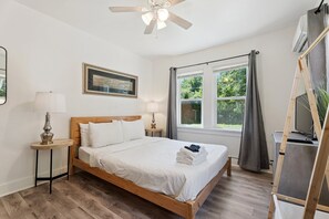 Wake up to sunlight through large windows and unwind with your favorite shows on the smart TV.