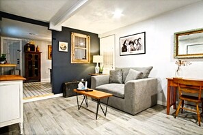 The living room exudes warmth and comfort, inviting you to sink into cozy seating