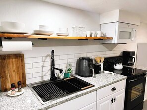 The kitchen is equipped with everything you need to create delicious meals in style