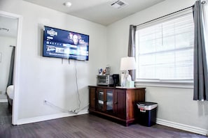 A living room where modern furnishings meet homely comfort, perfect for cozy evenings