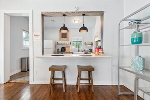 Start your day at the breakfast bar with a cup of coffee or unwind with a glass of wine while chatting with the cook in the kitchen.