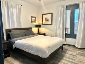 Tranquil bedroom retreat with natural light and cozy rug