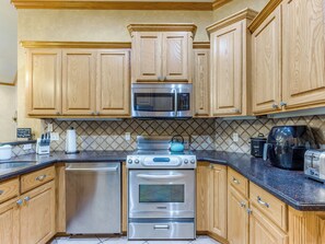 Whip up delicious meals in this well-equipped kitchen, blending modern convenience with rustic charm.