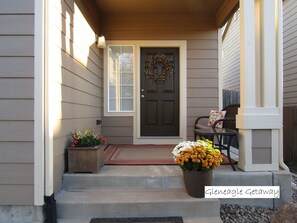 Inviting front porch. Front door has smart lock for easy self-access.