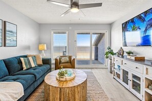 Bright and airy space with beach views, stylish decor, and comfortable seating!