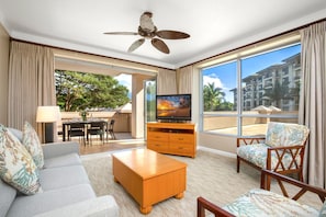 Sunlit living room with unbeatable balcony access.