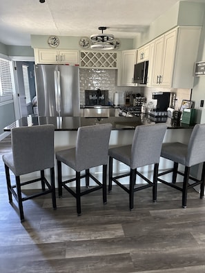 This kitchen will welcome you with new appliances, granite countertops