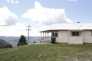 View from the driveway looking toward the side of the house.