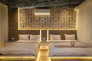 Bed wibackboards carved with ancient Egyptian hieroglyphic symbols light up
